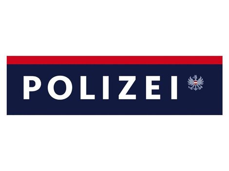 A logo of the police in blue, red, and white. The word "POLICE" is written in capital letters on it.